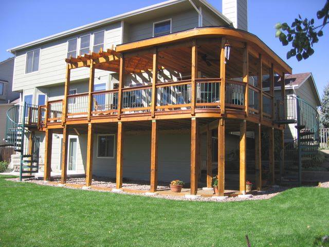 custom wooden deck installed on house exterior